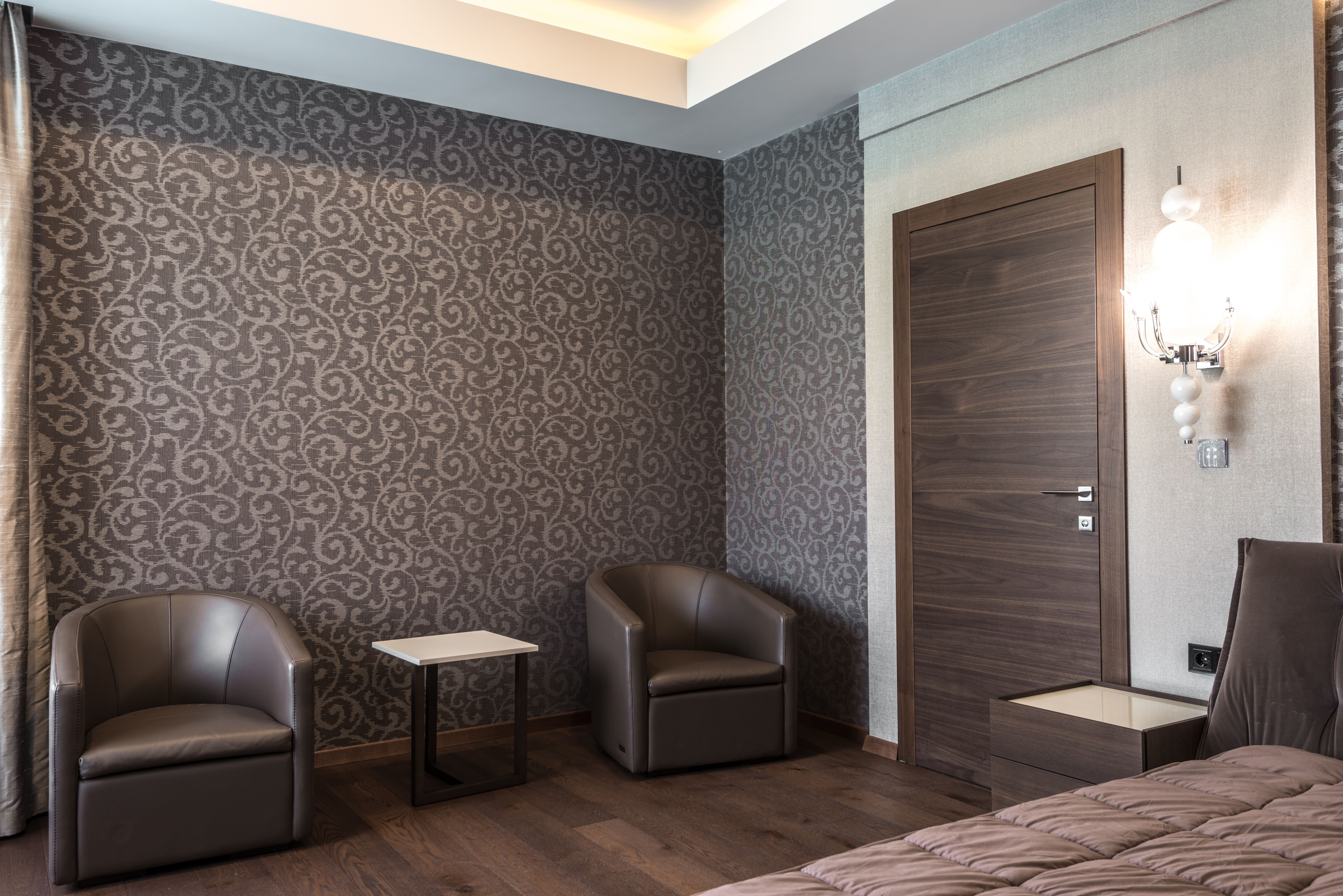 Luxurious boutique hotel room with modern furniture and stylish decor, suitable for a conversion-focused hotel ad.
